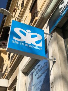 Enseigne et Vitrophanie - Enseigne drapeau Sia Immobilier